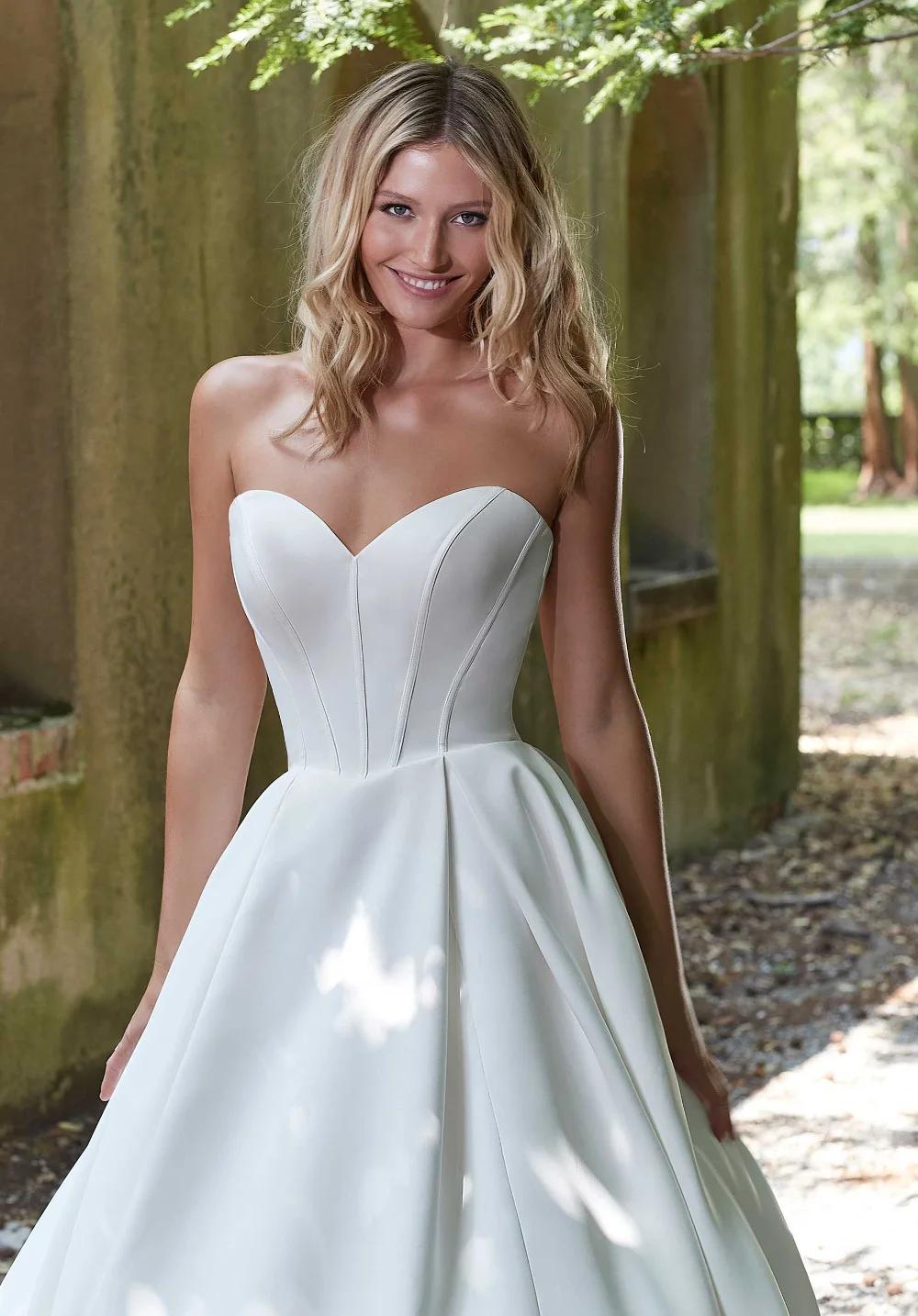 Photo of Model wearing a Morilee Collection White Gown