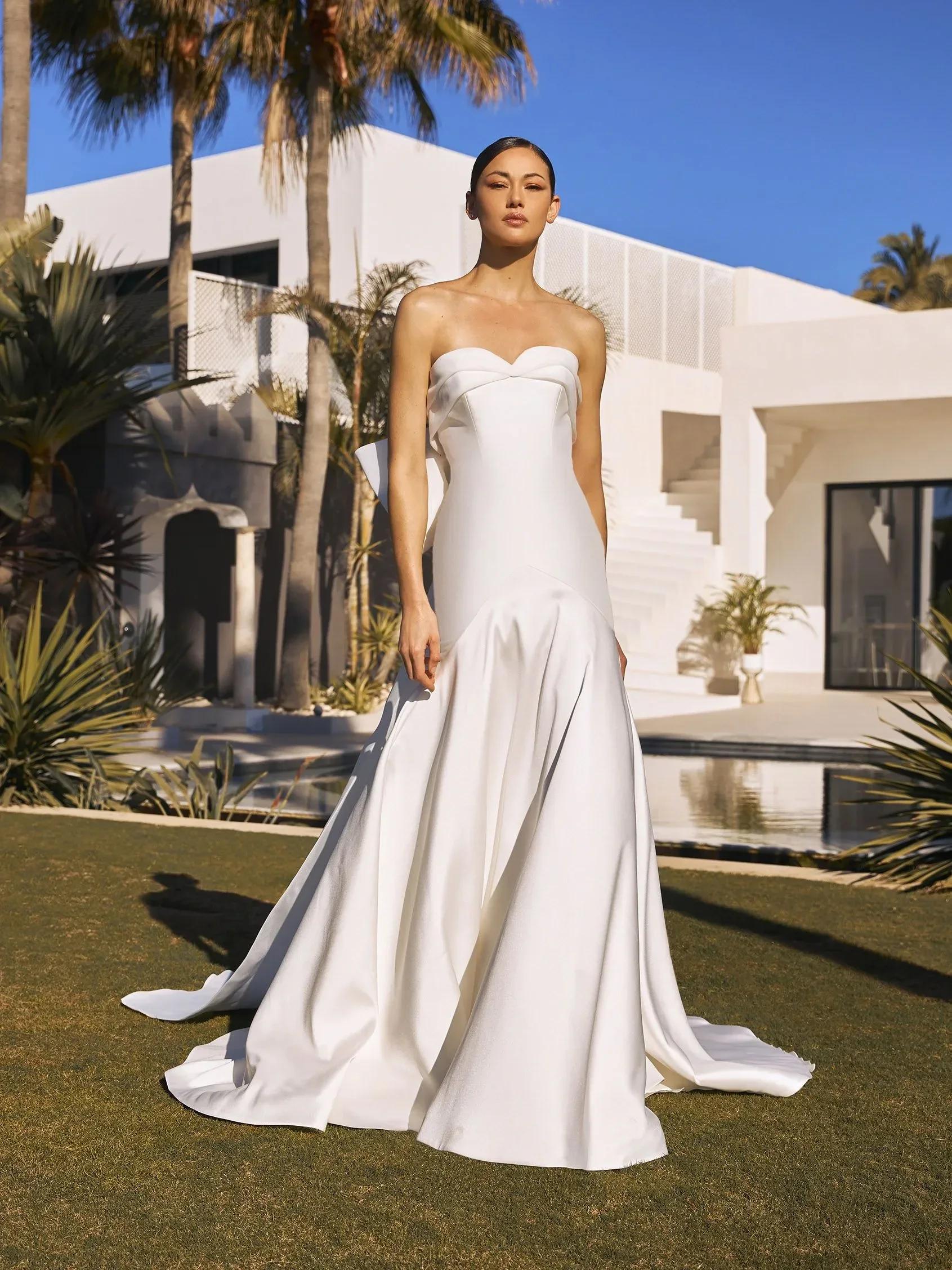 Photo of Model wearing a Pronovias Collection White Gown